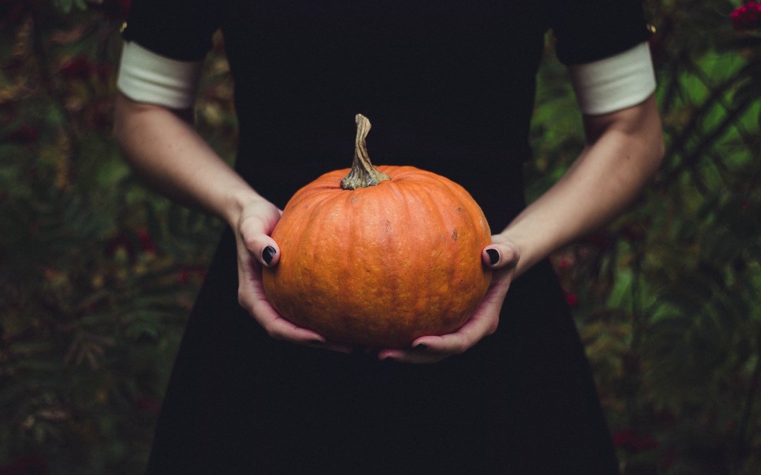 Woman holding pumpkin